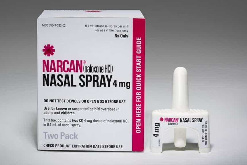 Narcan nasal spray next to packaging